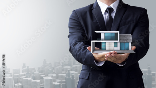 business man create design modern house