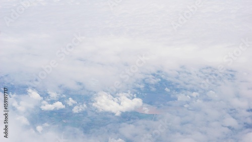 Fototapeta Naklejka Na Ścianę i Meble -  clouds over land, view from plane