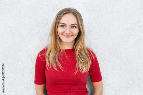 People, emotions, lifestyle, beauty, body language concept. Positive woman with fair hair, lively eyes and dimples looking happily into camera being pleased to have good day with her friends © sementsova321