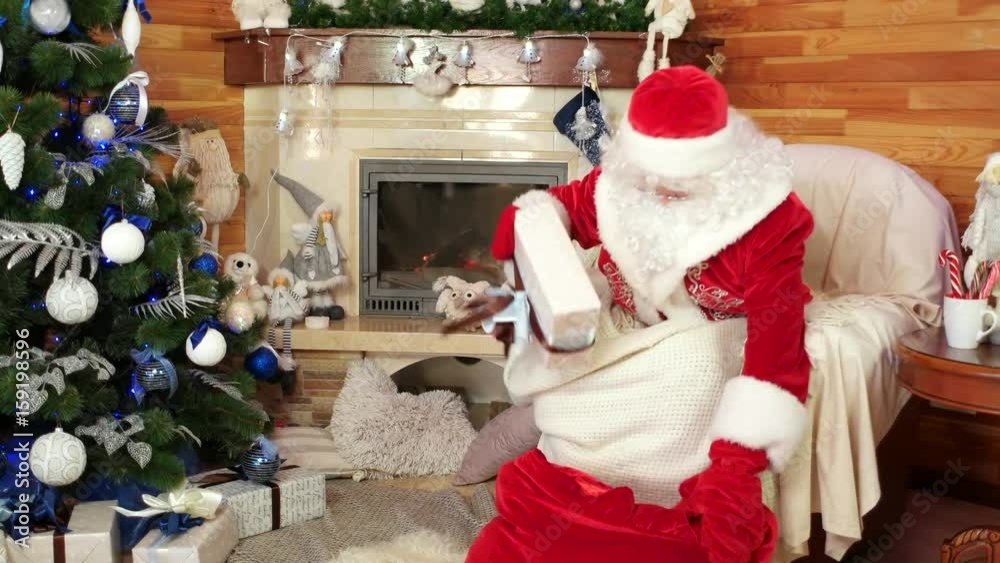 santa pack bag with presents, christmas gifts for obedient children, room with fireplace, decorated christmas tree, papa noel catch present boxes, winter holiday, saint nicolas prepare to visit kids