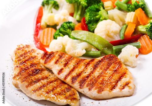 plate of grilled chicken with vegetables