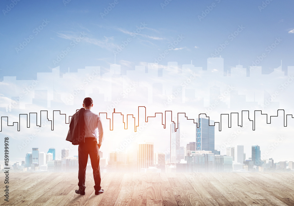 Motivation and inspiration concept with modern cityscape and businessman observing it