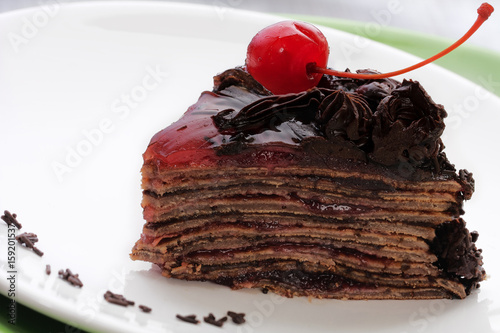 Obraz na płótnie Chocolate cake with cherry w salonie