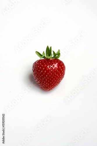 Red strawberry isolated on white background.