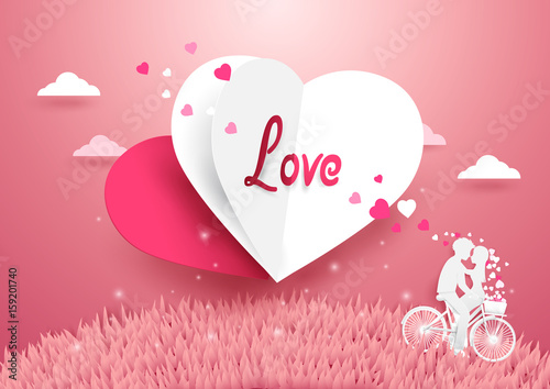 Love concept background. White and Red Heart flying over grass with Sweet couple on bicycle