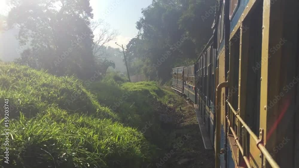Scenic landscapes passing behind train window. India. HD.