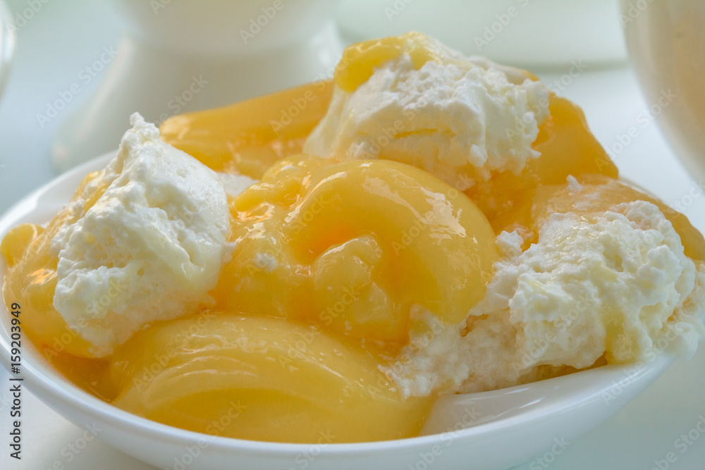 The souffle gentle on a delicate saucer closeup. Dessert jelly yellow - white color. The souffle gentle on a delicate saucer closeup. Dessert jelly yellow - white color.