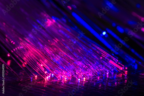 Luminous optical fiber on a black background