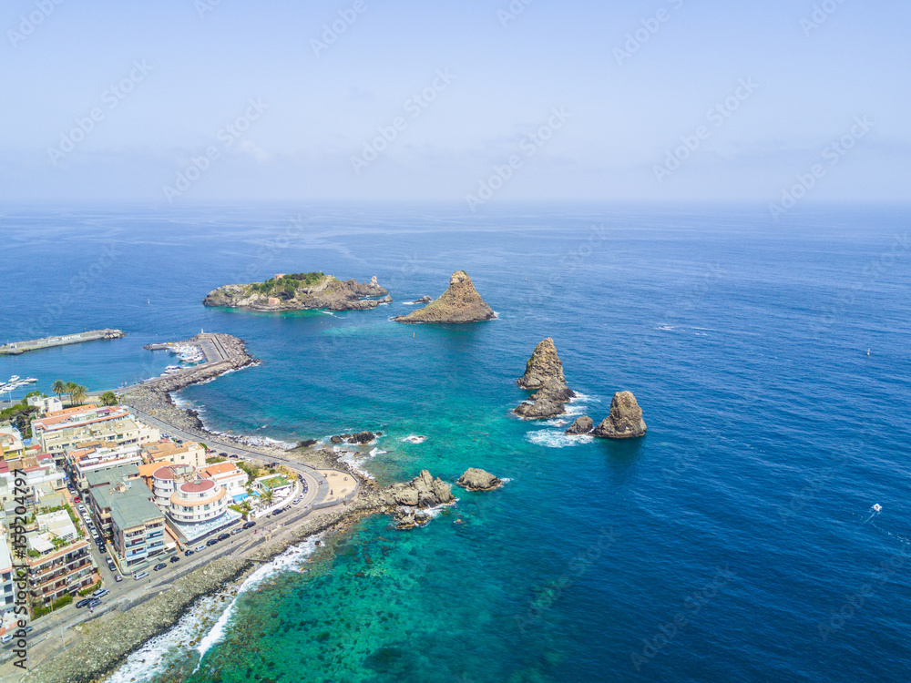 Cyclops islands, Acitrezza, Sicily. Basalt rocks on the sea view from top - Catania, Sicily - Italy