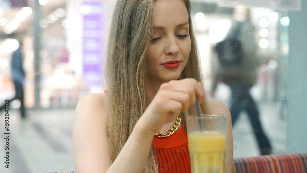 Beautiful girl sitting in the cafe and eating smoothie, steadycam shot
Beautiful girl sitting in the cafe and eating smoothie, steadycam shot