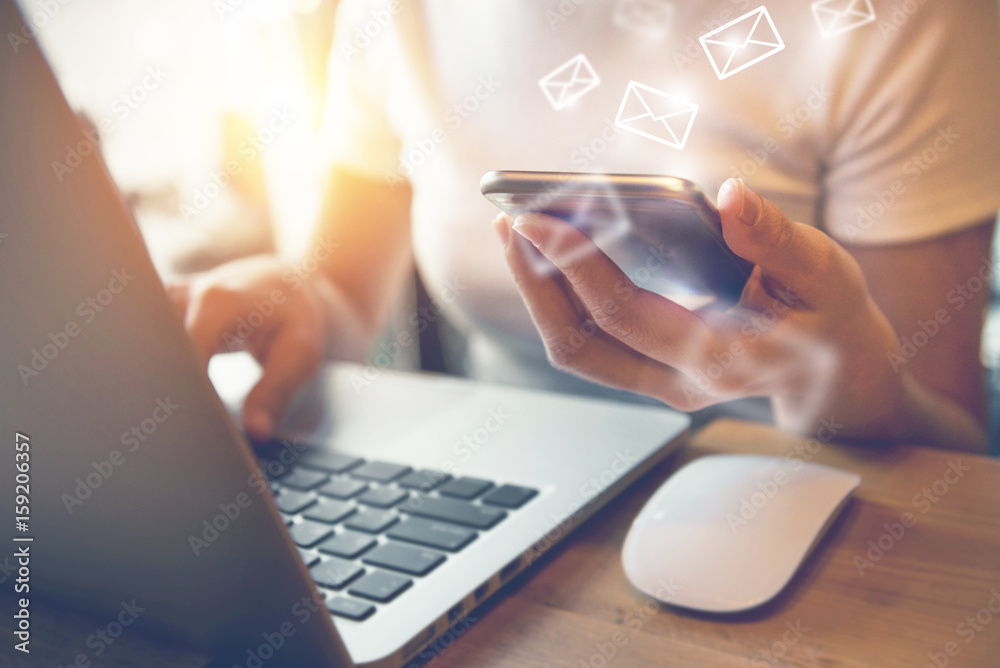 Closeup Woman hand using smart phone with sending email icon, Email concept Closeup Woman hand using smart phone with sending email icon, Email concept