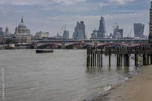 City of London skyline, as viewed from the south bank of the River Thames. St. Paul's can be clearly seen along side the modern day sky scrapers
