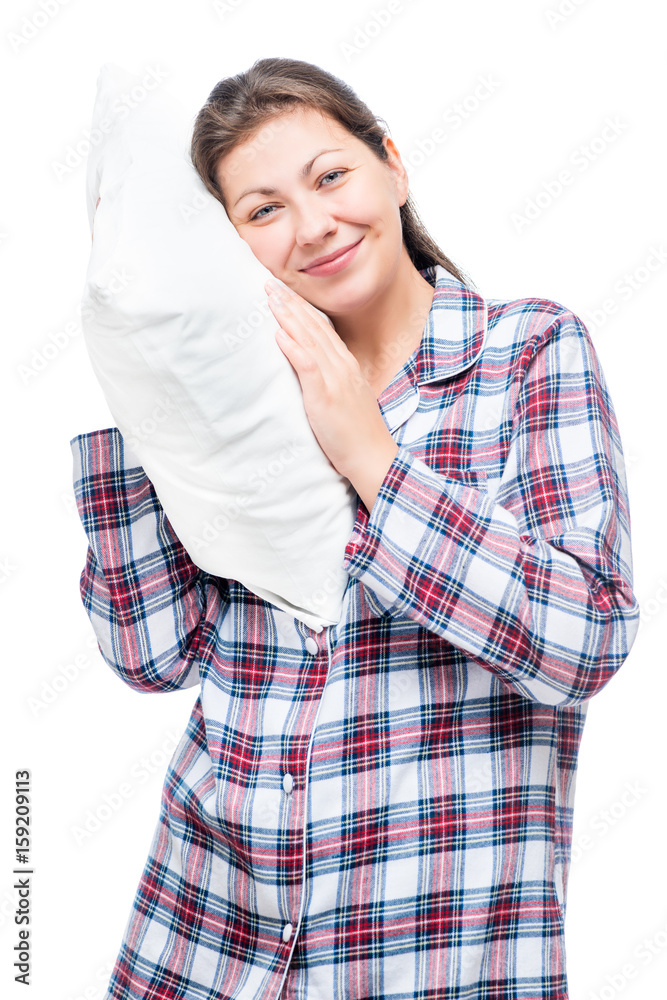 Vertical portrait of a woman in pajamas with a soft pillow isolated Vertical portrait of a woman in pajamas with a soft pillow isolated