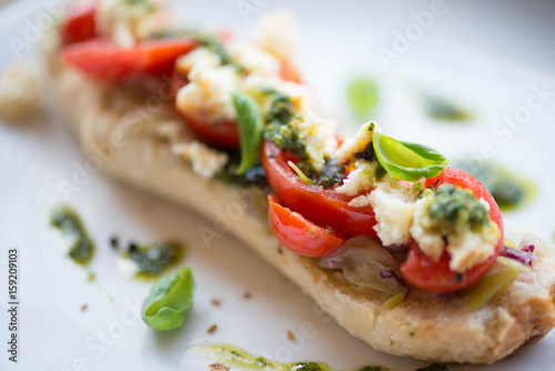 Italian Frisella bread with tomatoes and basil