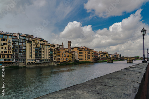 Horizontal composition of the River Arno in Florence  with dramatic clouds.