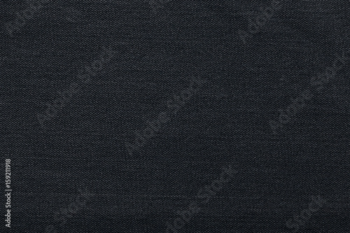 Black background, denim jeans background. Jeans texture, fabric.
