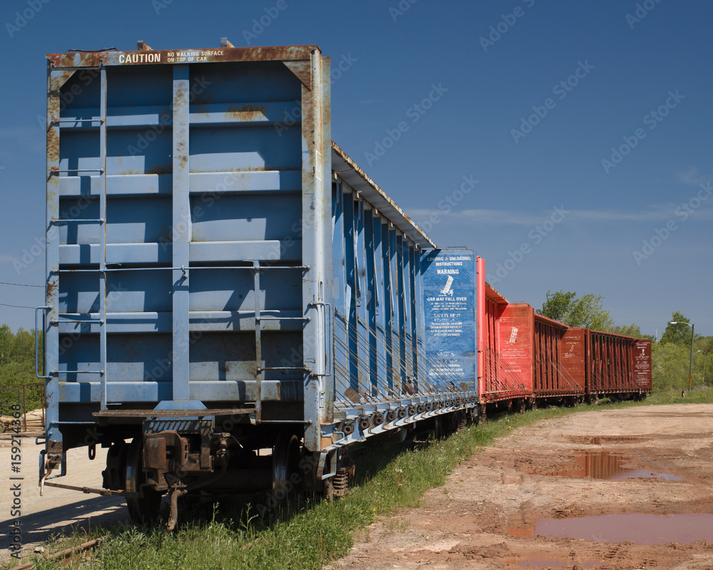 Empty freight train cars on side track