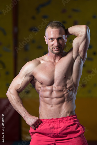 Muscular Bodybuilder Showing His Front Abdominal Abs