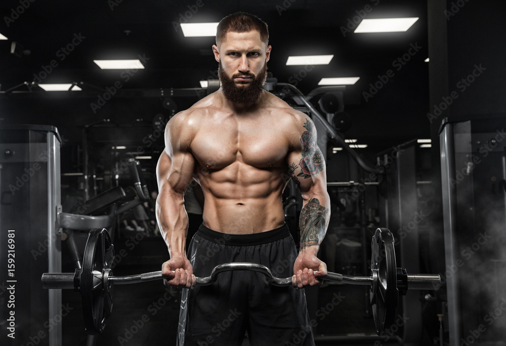 Handsome Muscular Fitness Bodybuilder Doing Heavy Weight Exercise