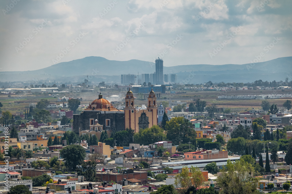 Fototapeta premium Aerial view of Parroquia de San Andres Apostol (Saint Andrew the Apostle Church) - Cholula, Puebla, Mexico