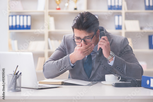 Businessman during fire alarm in office