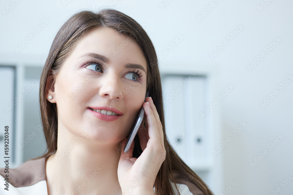 Successful business woman getting good news on mobile phone. Successful business woman talking on mobile phone. Business success concept. Successful business woman getting good news on mobile phone. Successful business woman talking on mobile phone. Business success concept.