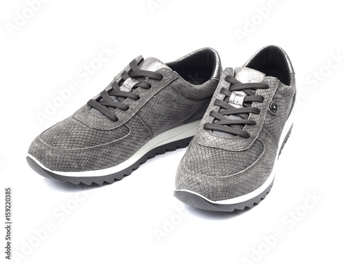 Gray female suede sneakers isolated on white background with clipping path