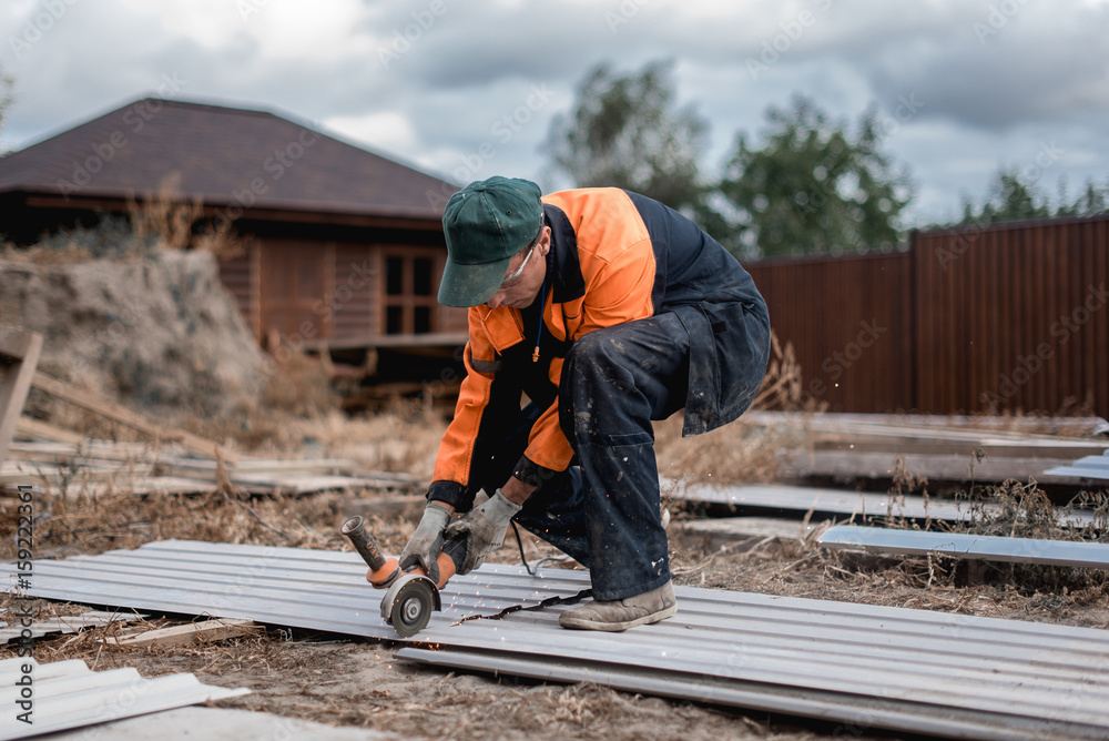 Young construction worker outdoors. Renovation background. Young construction worker outdoors. Renovation background.
