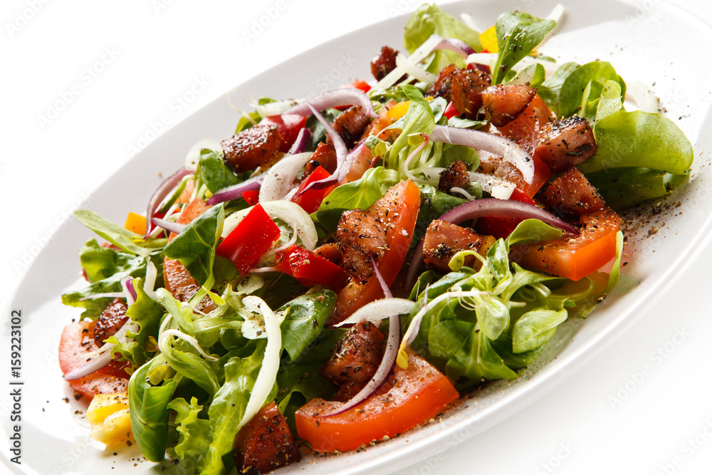 Salad with smoked ham on white background 