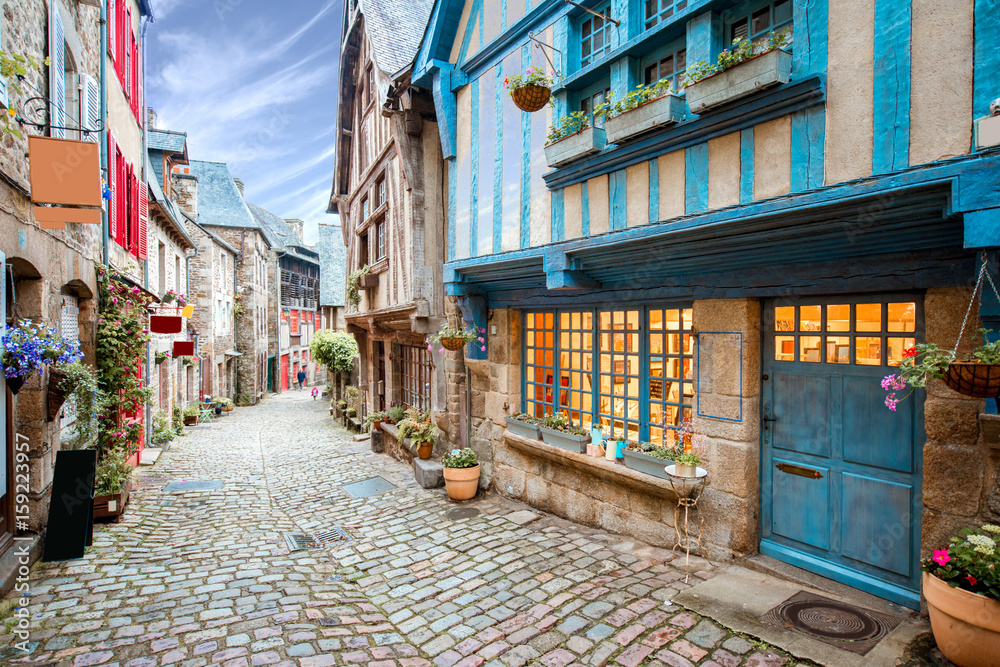Street view at the famous Dinan town in Brittany region in France - obrazy, fototapety, plakaty 