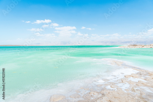 View of Dead Sea coastline. Salt crystals. Texture of Dead sea. Salty sea shore photo