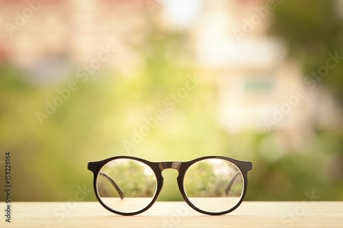 Vintage glasses on wooden table.