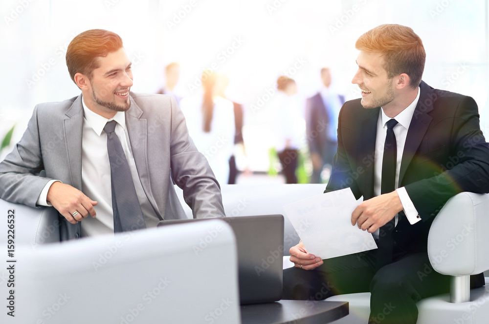 Fototapeta premium Image of business partners discussing documents and ideas at mee