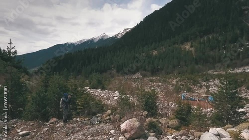 photographer photographing a glacier in the mountains photo