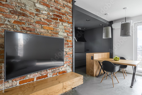 Modern aprtment with brick wall photo