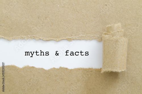 myths and facts written under torn paper. photo