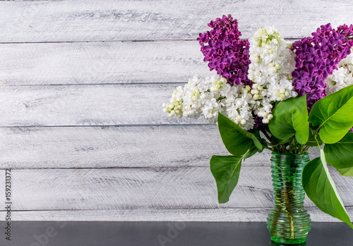 lilac flowers on wooden background. cover, card. copy space.