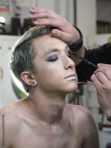 Make up artist makes make-up at the eyelashes