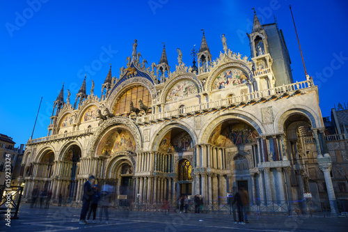 Saint Mark's Basilica at night with blurry people