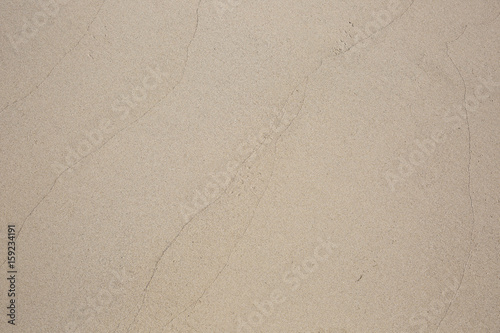 closeup of sand pattern of a beach in the summer