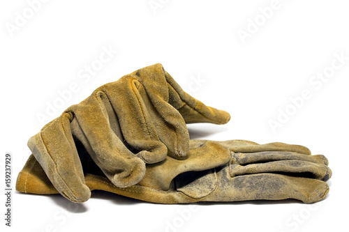 Worn leather work gloves. Isolated.
