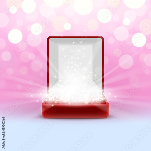Open jewelry box with glowing from inside