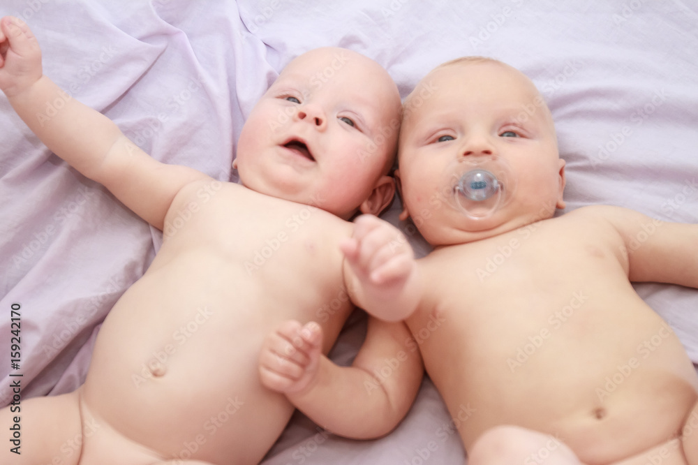 indoor portrait of two young baby twins at home indoor portrait of two young baby twins at home