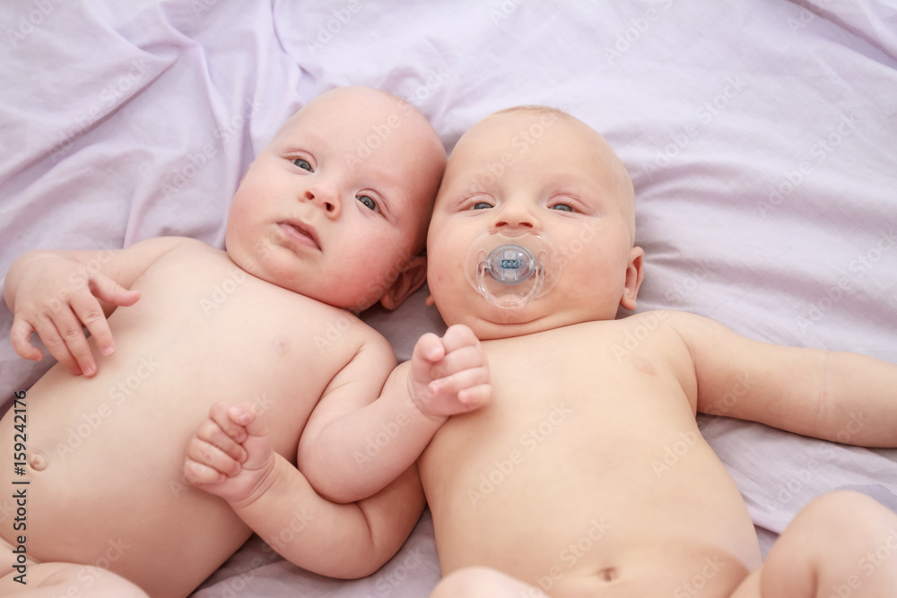 indoor portrait of two young baby twins at home indoor portrait of two young baby twins at home