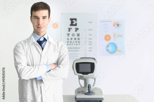 Handsome male ophthalmologist in clinic
