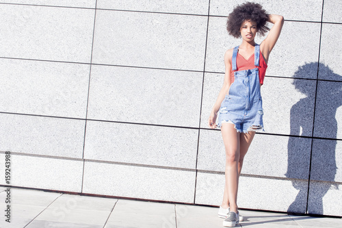 Girl with afro posing.