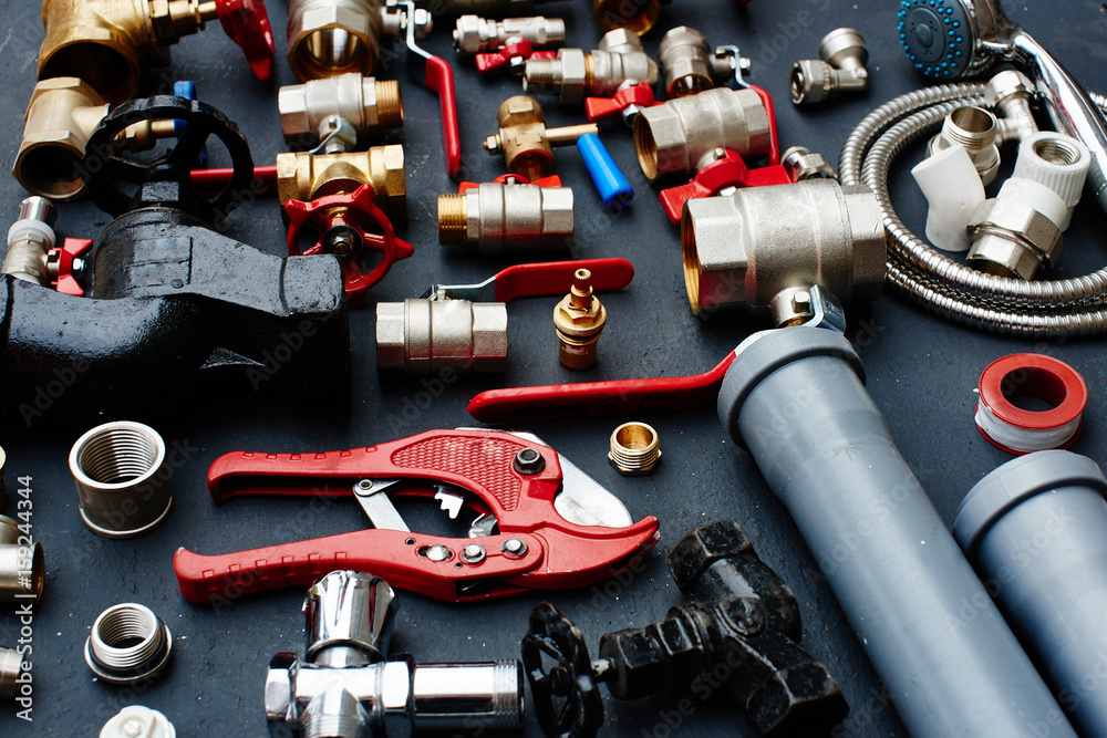 Plumbing equipment on a black background Stock Photo Adobe Stock