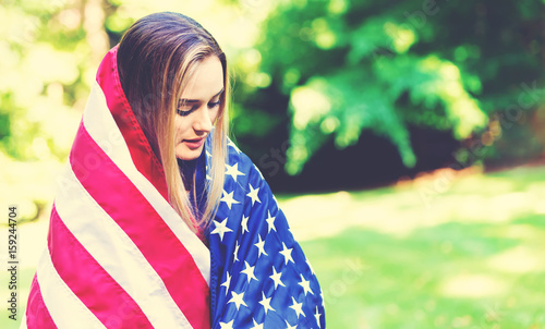 GIrl with an American flag on the fourth of July