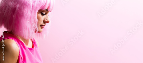 Beautiful woman in a bright pink wig