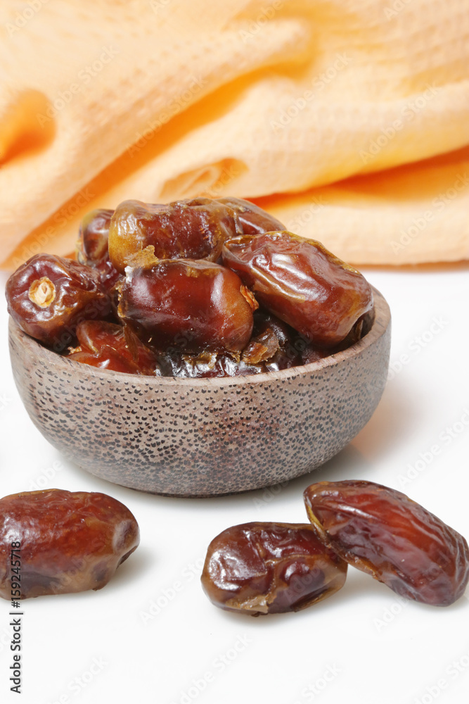 Fototapeta premium Dried dates in small bowl